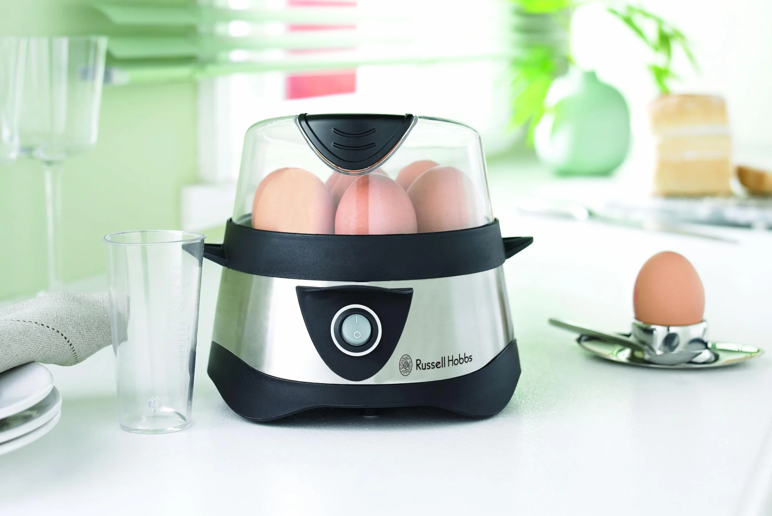 Russell Hobbs Cocedor de Huevos Cook@Home - Capacidad para Hervir 7 Huevos y Pochar 3 Huevos, Apagado Automático, Incluye Recipiente Medidor, Tapa Plástico, Acero Inoxidable - 14048-56